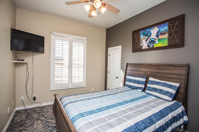 bedroom with ceiling fan and carpet flooring