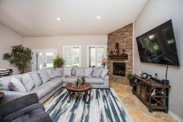 living room featuring french doors, a fireplace, and vaulted ceiling