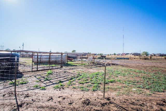 view of yard with a rural view