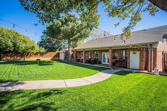 view of yard featuring french doors