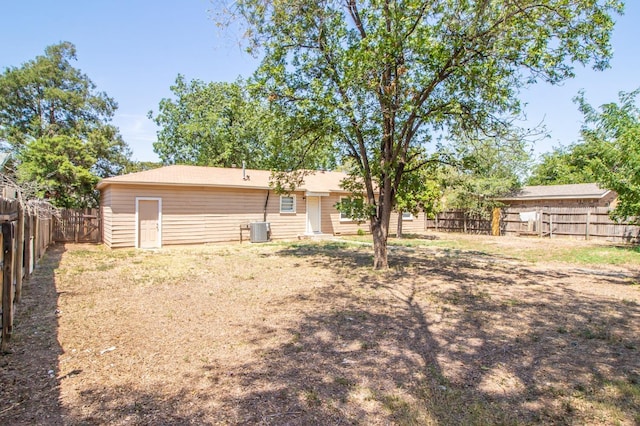 back of property featuring central AC unit