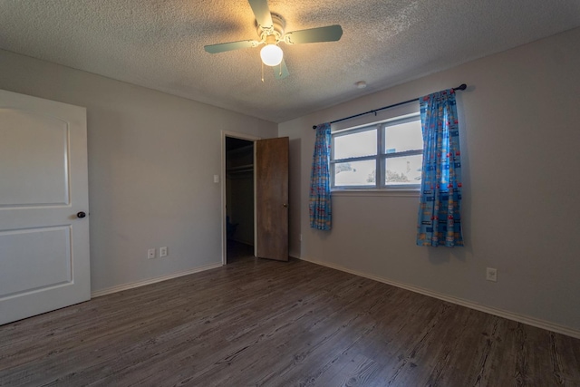 unfurnished bedroom featuring hardwood / wood-style flooring, ceiling fan, a textured ceiling, and a closet