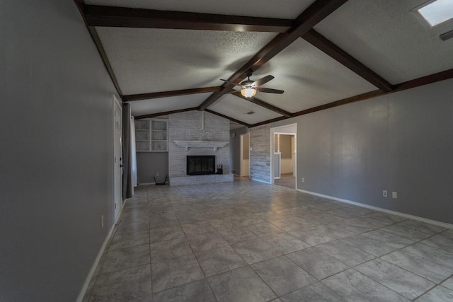 unfurnished living room with ceiling fan, a fireplace, lofted ceiling with beams, and a textured ceiling