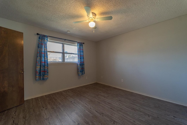 unfurnished room with a textured ceiling, dark hardwood / wood-style floors, and ceiling fan