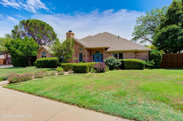 4801 Amherst St, Lubbock, TX 79416 - view of front facade featuring a chimney, brick siding, and roof with shingles
