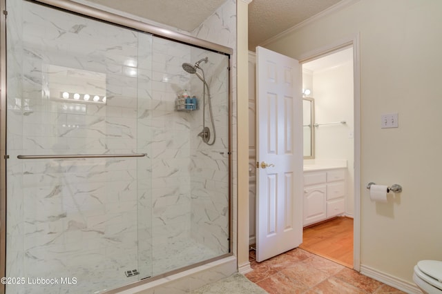 4801 Amherst St, Lubbock, TX 79416 - bathroom featuring a marble finish shower, vanity, ornamental molding, and a textured ceiling