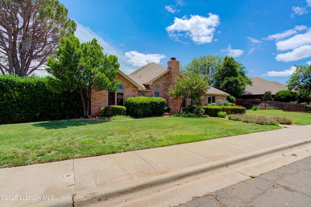 4801 Amherst St, Lubbock, TX 79416 - view of front of house featuring brick siding and a chimney