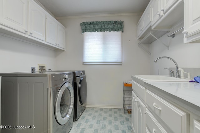 4801 Amherst St, Lubbock, TX 79416 - washroom featuring washing machine and clothes dryer, cabinet space, light flooring, and ornamental molding
