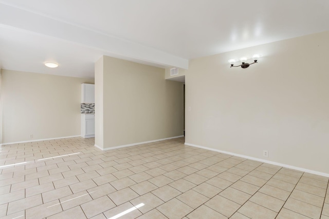 view of tiled spare room