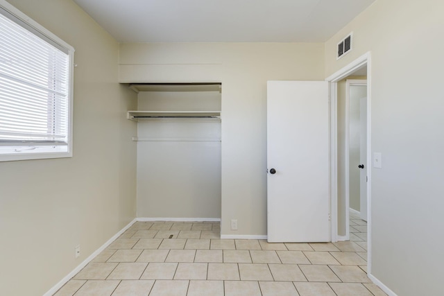 unfurnished bedroom with a closet