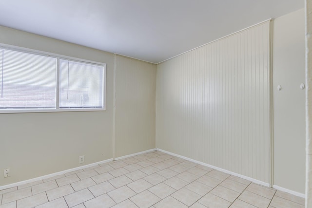 empty room with light tile patterned floors