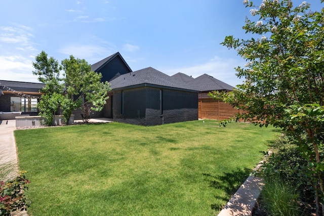 view of yard featuring a patio and fence