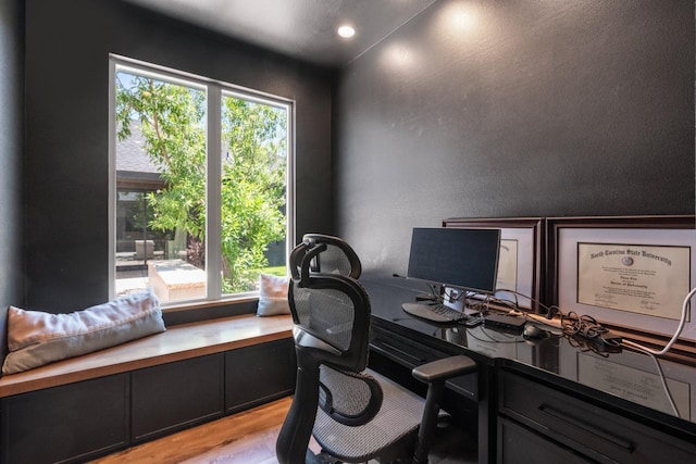 office area with plenty of natural light and light hardwood / wood-style floors