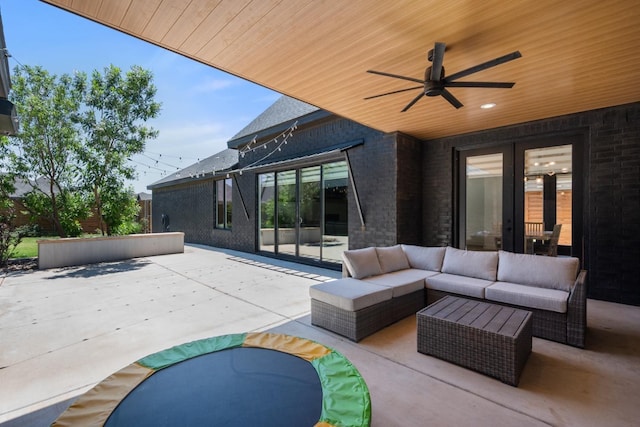 view of patio featuring a ceiling fan, french doors, and an outdoor hangout area