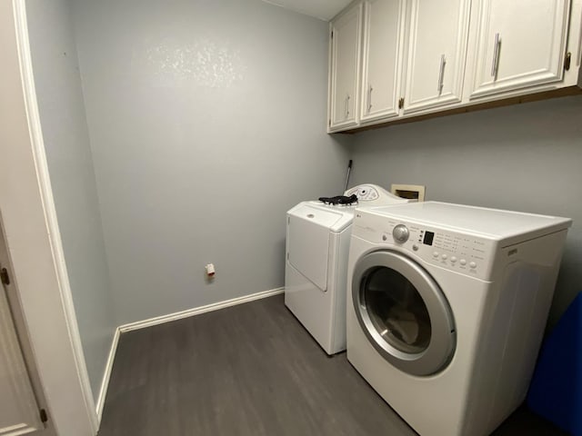 laundry area with cabinets, dark hardwood / wood-style floors, and independent washer and dryer