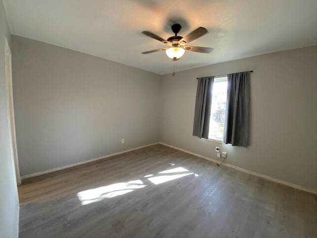 unfurnished room featuring ceiling fan and wood-type flooring