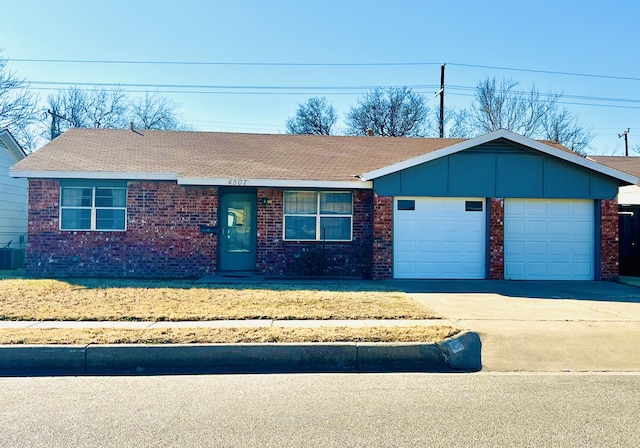 4507 54th St, Lubbock, TX 79414 - ranch-style home featuring brick siding, driveway, a garage, and a shingled roof