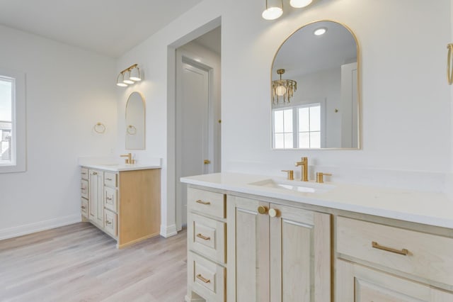 bathroom with vanity and hardwood / wood-style flooring