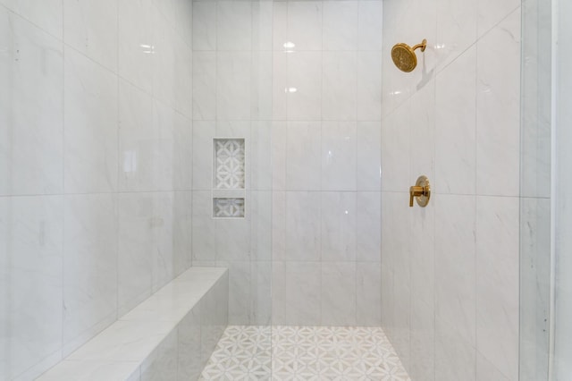 bathroom featuring tiled shower