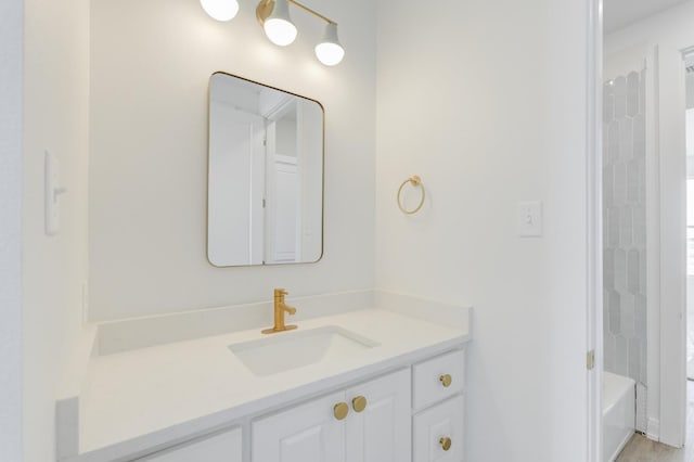 bathroom featuring vanity and shower / bath combination