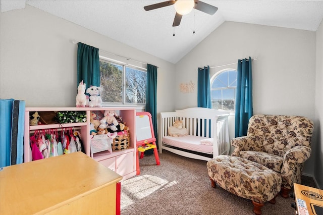 bedroom with ceiling fan, lofted ceiling, a closet, and carpet