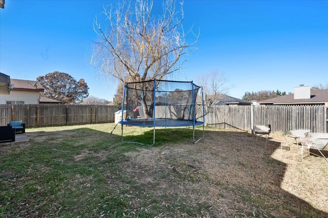 view of yard with a trampoline