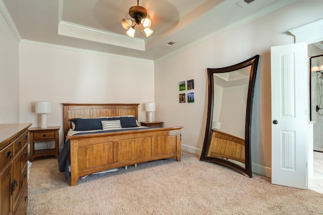 carpeted bedroom featuring a raised ceiling, crown molding, and ceiling fan