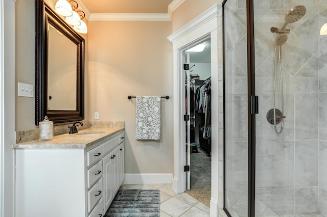 bathroom with crown molding, vanity, tile patterned floors, and a shower with shower door