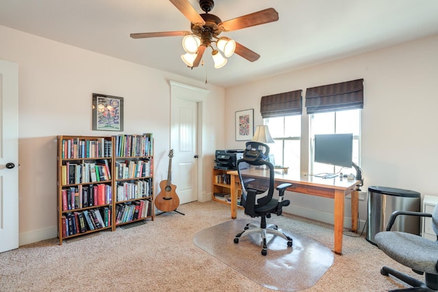 carpeted office featuring ceiling fan