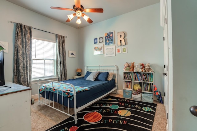 carpeted bedroom featuring ceiling fan