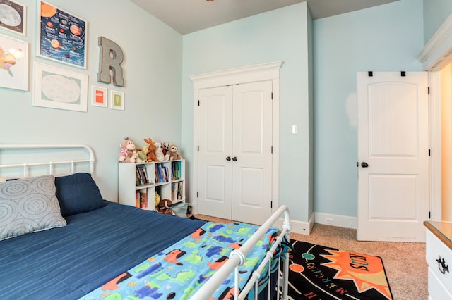 carpeted bedroom featuring a closet