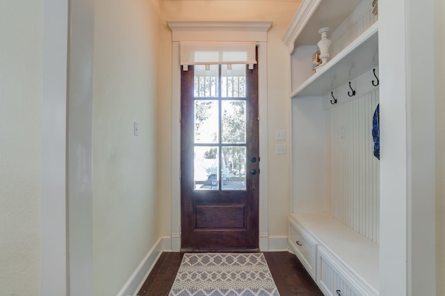 mudroom with dark wood-type flooring and a wealth of natural light