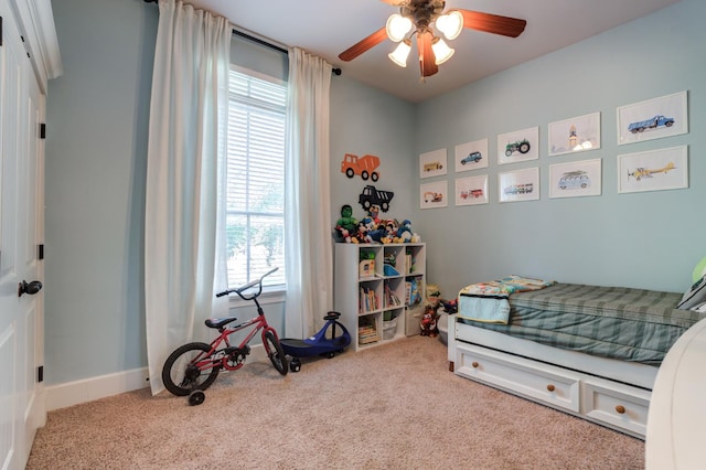 carpeted bedroom with ceiling fan