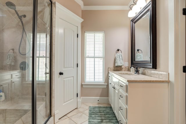 bathroom featuring a shower with door, ornamental molding, vanity, and tile patterned floors