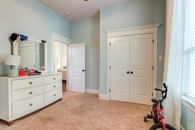 carpeted bedroom featuring a closet