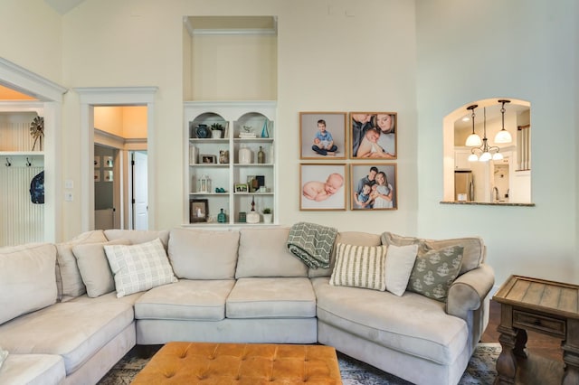 living room with an inviting chandelier