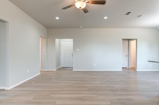 empty room with ceiling fan and light hardwood / wood-style floors