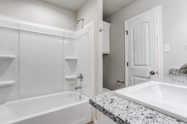 full bathroom featuring shower / tub combination, vanity, and toilet