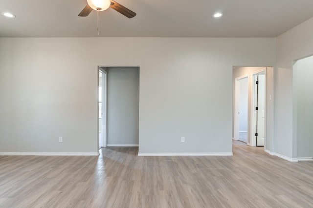 unfurnished room featuring ceiling fan and light wood-type flooring