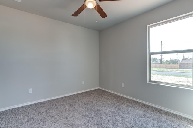 unfurnished room featuring ceiling fan and light colored carpet