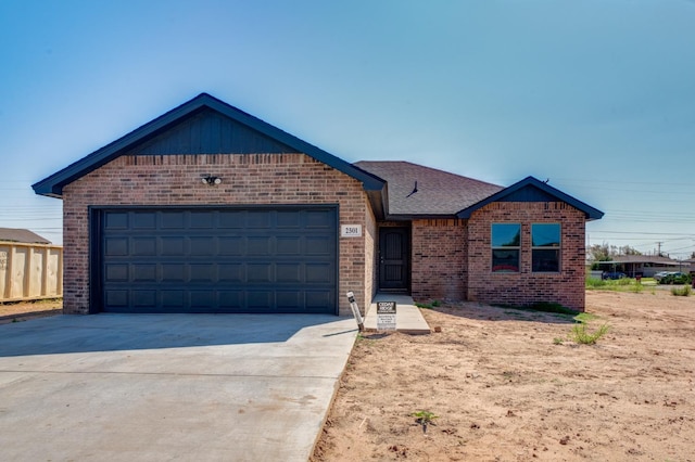 view of front of property with a garage