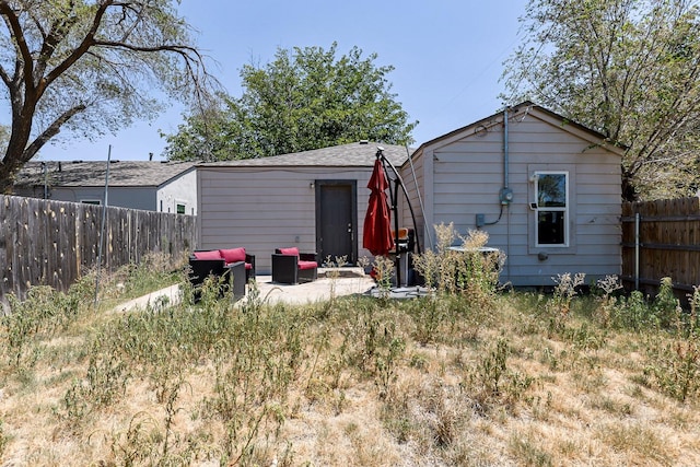 back of house featuring a patio area