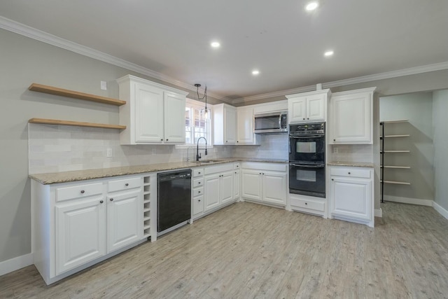 kitchen featuring sink, white cabinetry, crown molding, light hardwood / wood-style floors, and black appliances