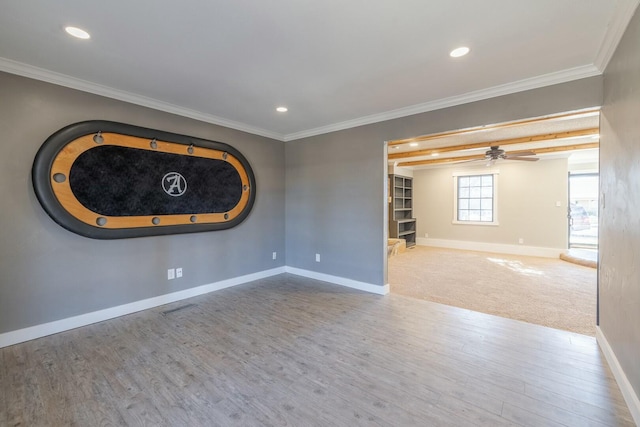 unfurnished room featuring hardwood / wood-style flooring, ornamental molding, and ceiling fan