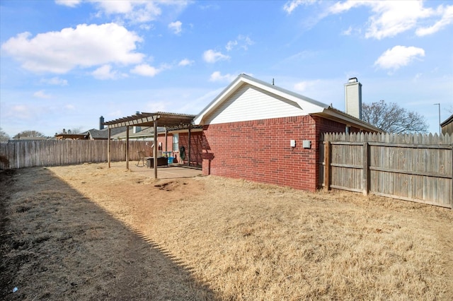 view of yard with a pergola and a patio