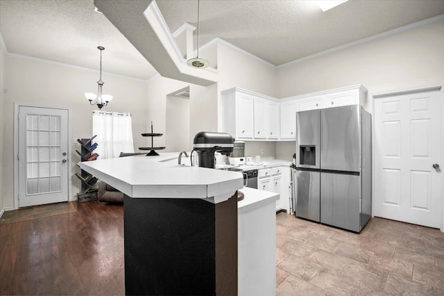 kitchen featuring pendant lighting, white cabinets, stainless steel fridge with ice dispenser, crown molding, and a textured ceiling