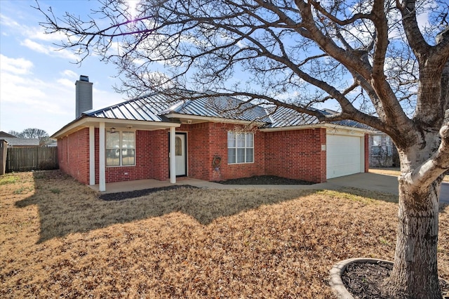 ranch-style house featuring a garage and a front yard