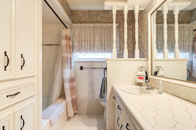 full bathroom with tile patterned flooring, vanity, shower / tub combo with curtain, and toilet