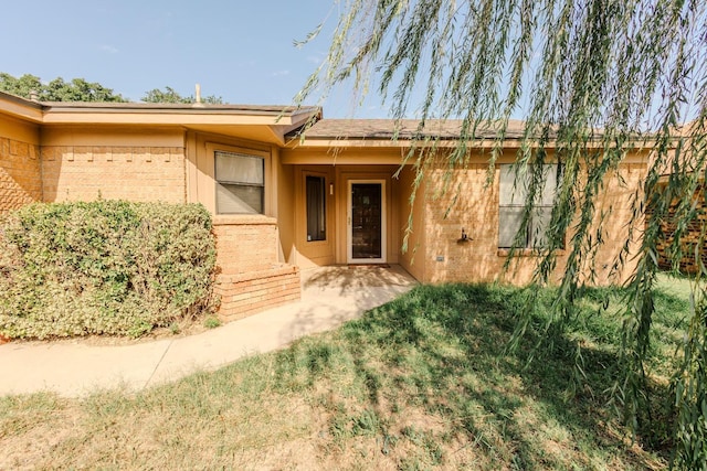 doorway to property with a patio