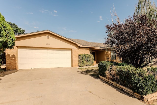 ranch-style home featuring a garage